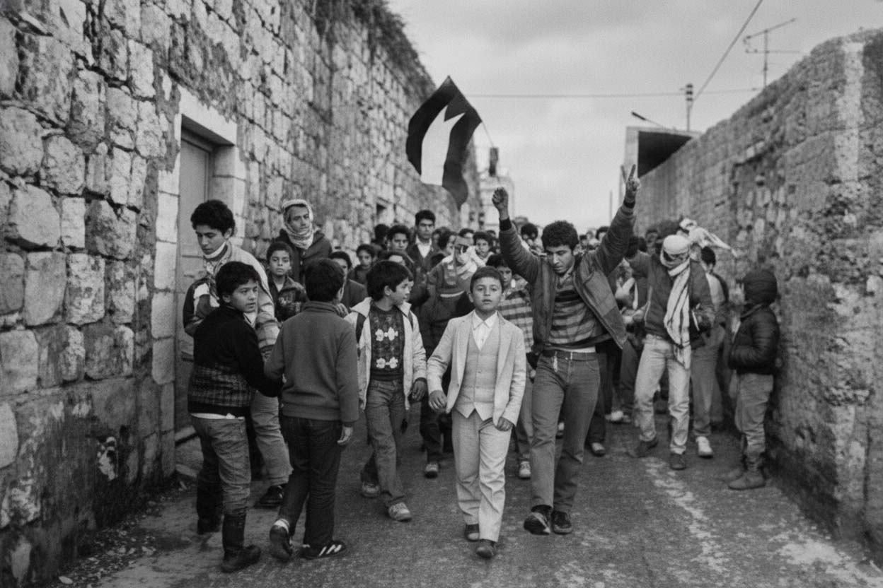 In 1987, the First Intifada erupted on 9 December after an Israeli truck driver killed four Palestinian workers at the Erez checkpoint in Gaza. The uprising was fueled by twenty years of Israeli military occupation, intensified settlement construction, and increasing repression. Israeli occupation forces killed between 1,087 and 1,204 Palestinians, including at least 241 children. More than 100,000 Palestinians were injured, approximately 120,000 were imprisoned, and 2,532 had their homes demolished. The Israeli government implemented a policy of deliberately breaking the bones of protesters, and many Palestinians were routinely tortured.